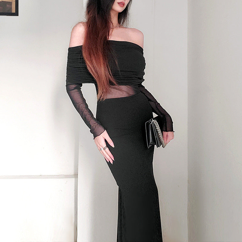Robe longue noir très élégante . Épaule dégager tissu mince léger.