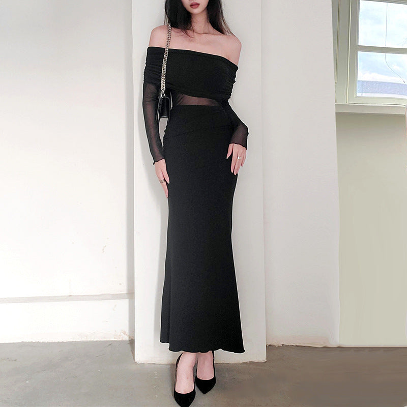 Robe longue noir très élégante . Épaule dégager tissu mince léger.