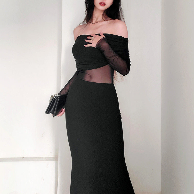Robe longue noir très élégante . Épaule dégager tissu mince léger.