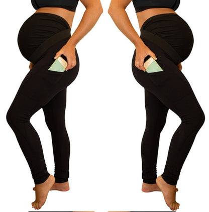 Pantalon de maternité à panneau de couleur pure, taille longue et haute, avec poches latérales