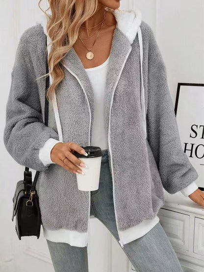Veste en laine doux cozy avec zipe et capuche. Tendance pour femme