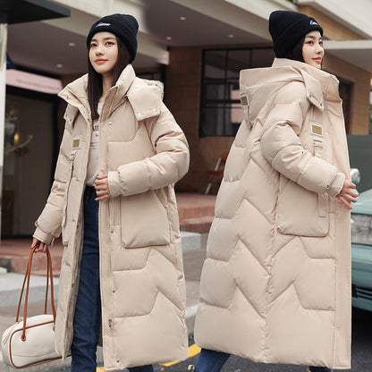 Magnifique manteau long duvet,  chaud, cozy et classique.  Couleur unie pour femme .