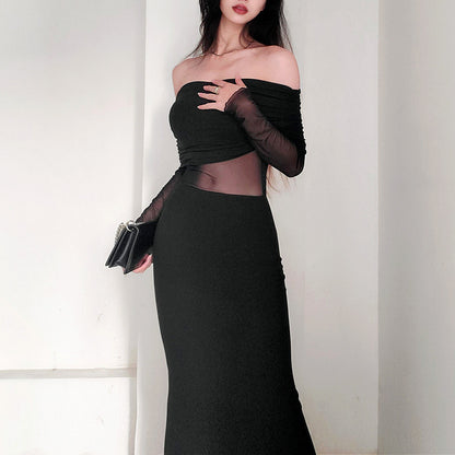 Robe longue noir très élégante . Épaule dégager tissu mince léger.