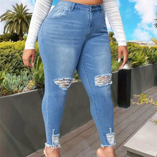Un jean taille haute extensible,  avec trou. Stylée fashion pour femme.