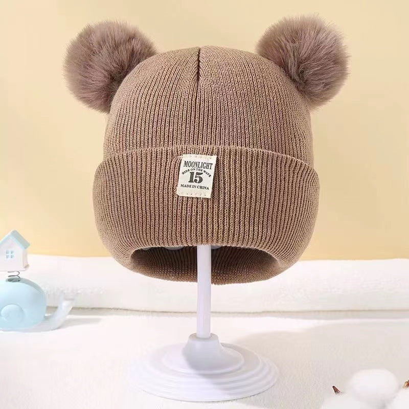 Bonnet bébé automne et hiver en laine cozy pour les tout petits.