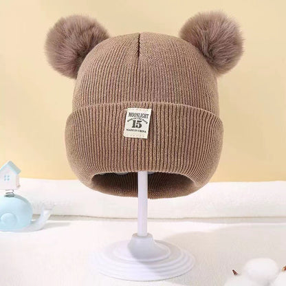 Bonnet bébé automne et hiver en laine cozy pour les tout petits.
