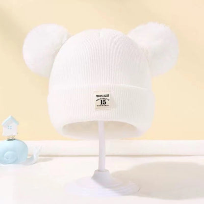 Bonnet bébé automne et hiver en laine cozy pour les tout petits.
