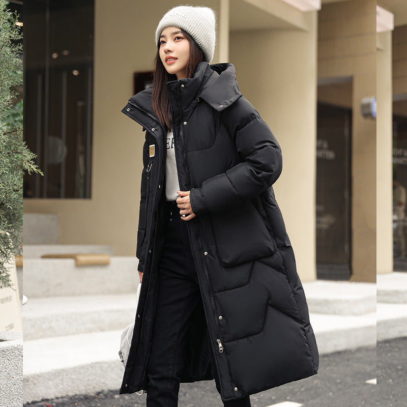 Magnifique manteau long duvet,  chaud, cozy et classique.  Couleur unie pour femme .