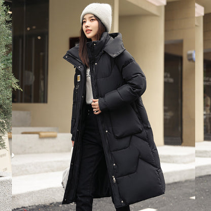 Magnifique manteau long duvet,  chaud, cozy et classique.  Couleur unie pour femme .